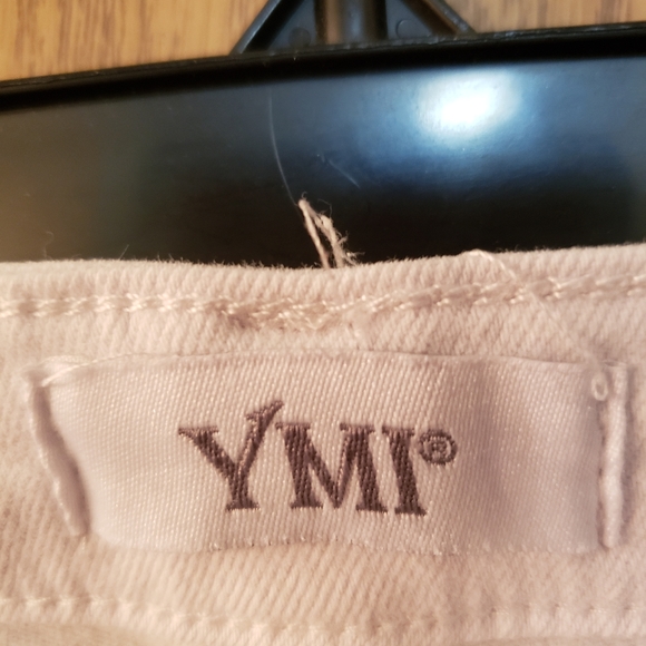 Cute white jeans, ripped at knees with flare bottoms. Great condition. - Picture 7 of 8